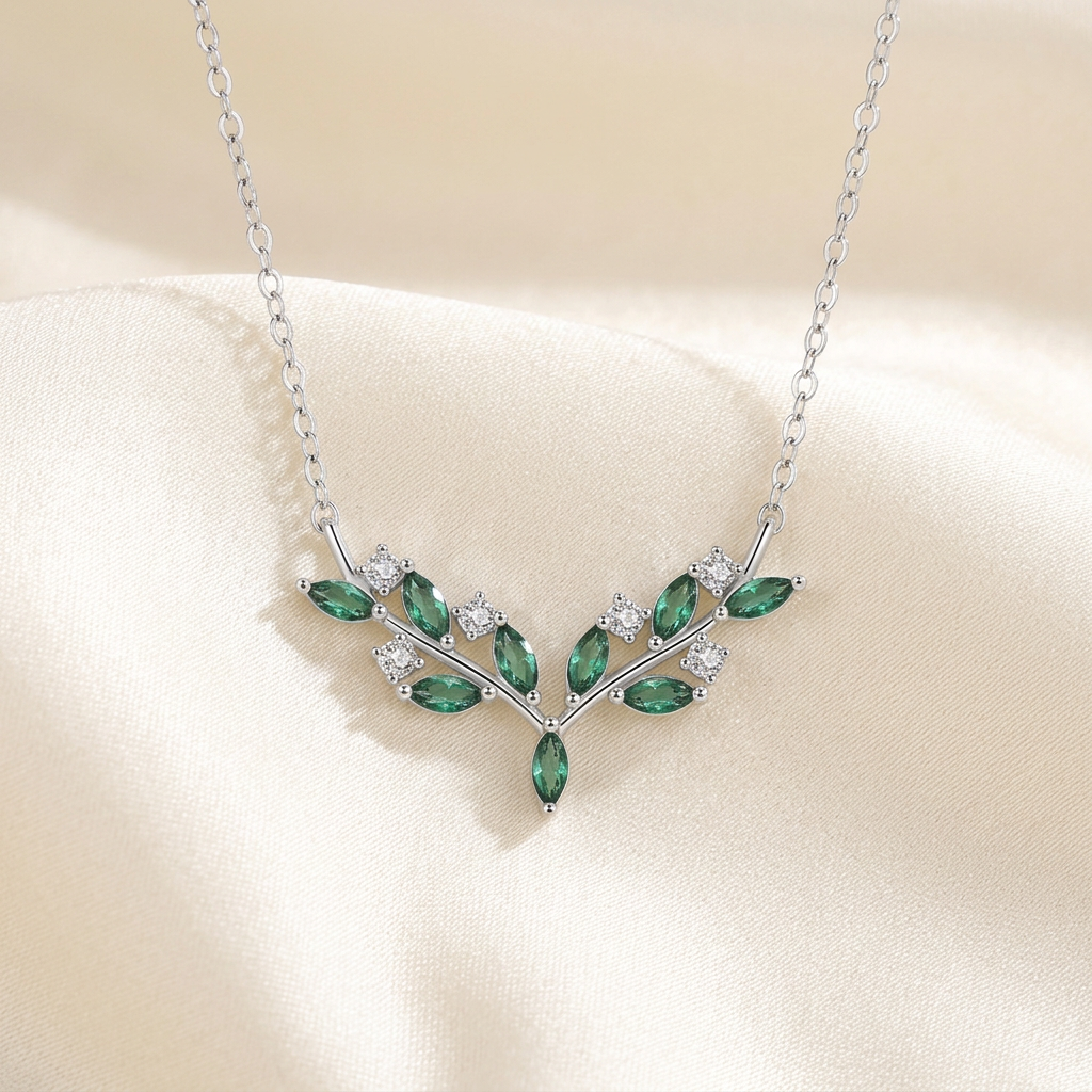 Green olive branch necklace on satin