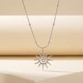 Silver-tone spiral sun pendant necklace with bead-detail chain