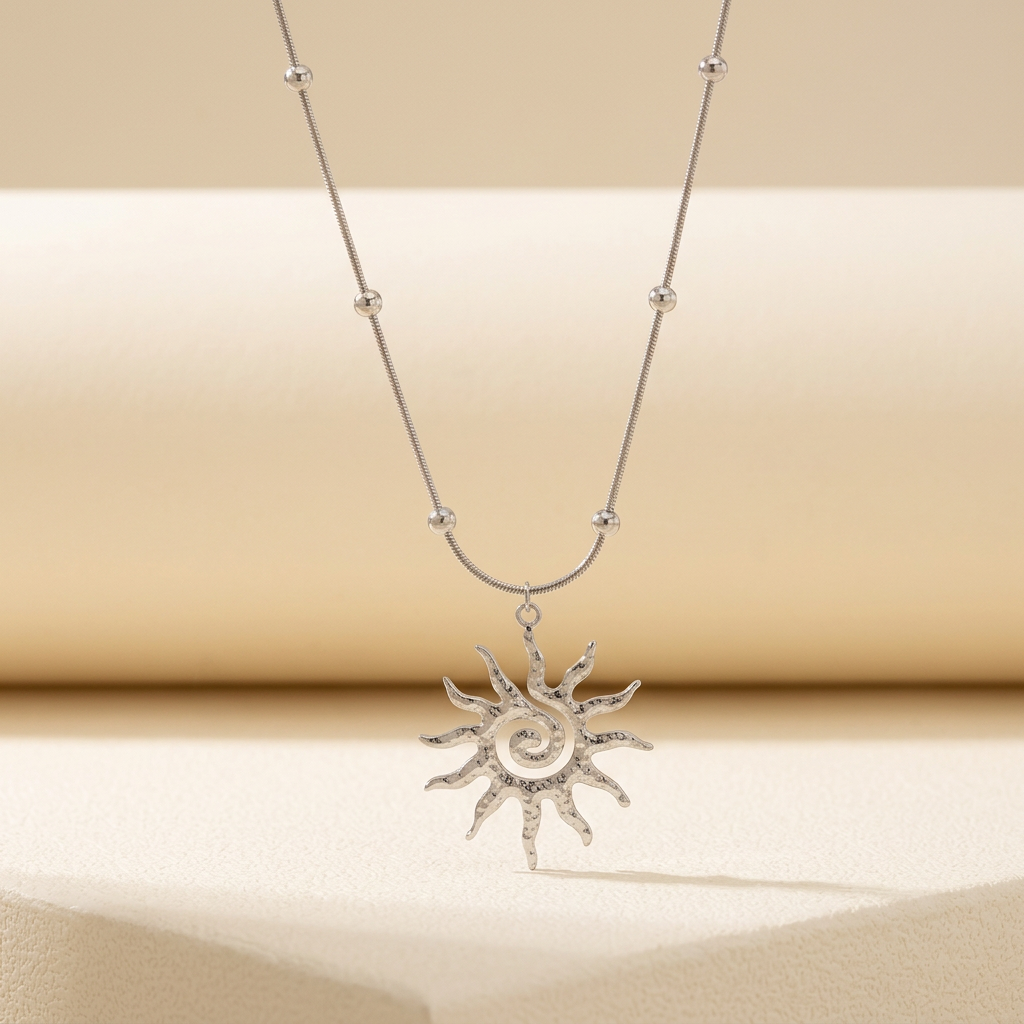 Silver-tone spiral sun pendant necklace with bead-detail chain