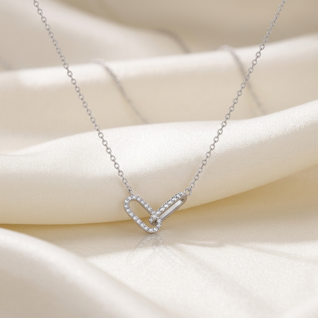 Silver-tone paperclip link necklace on ivory silk