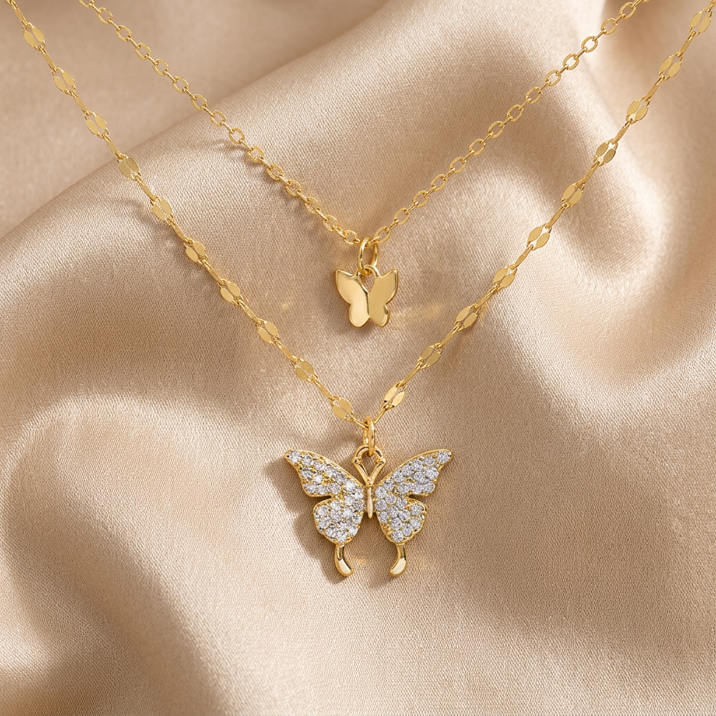 Gold-tone double-layer butterfly necklace on champagne silk