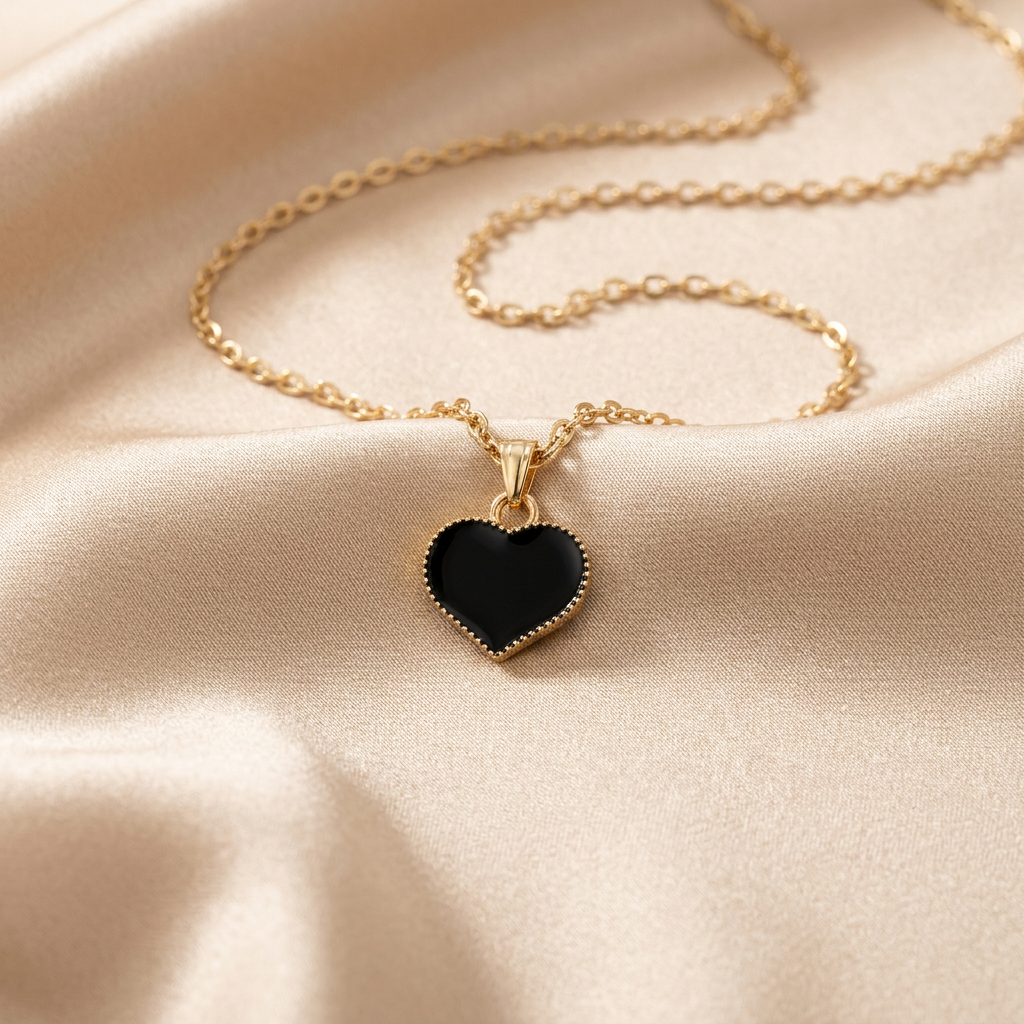 Black enamel heart pendant necklace on champagne silk