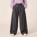 Gray oversized pleated trousers front showing wide leg volume