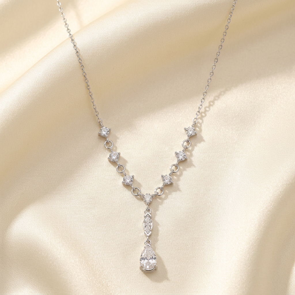 Pear-drop necklace on satin