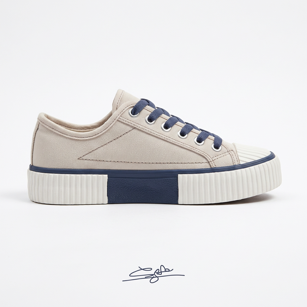 Plain beige canvas sneaker side view