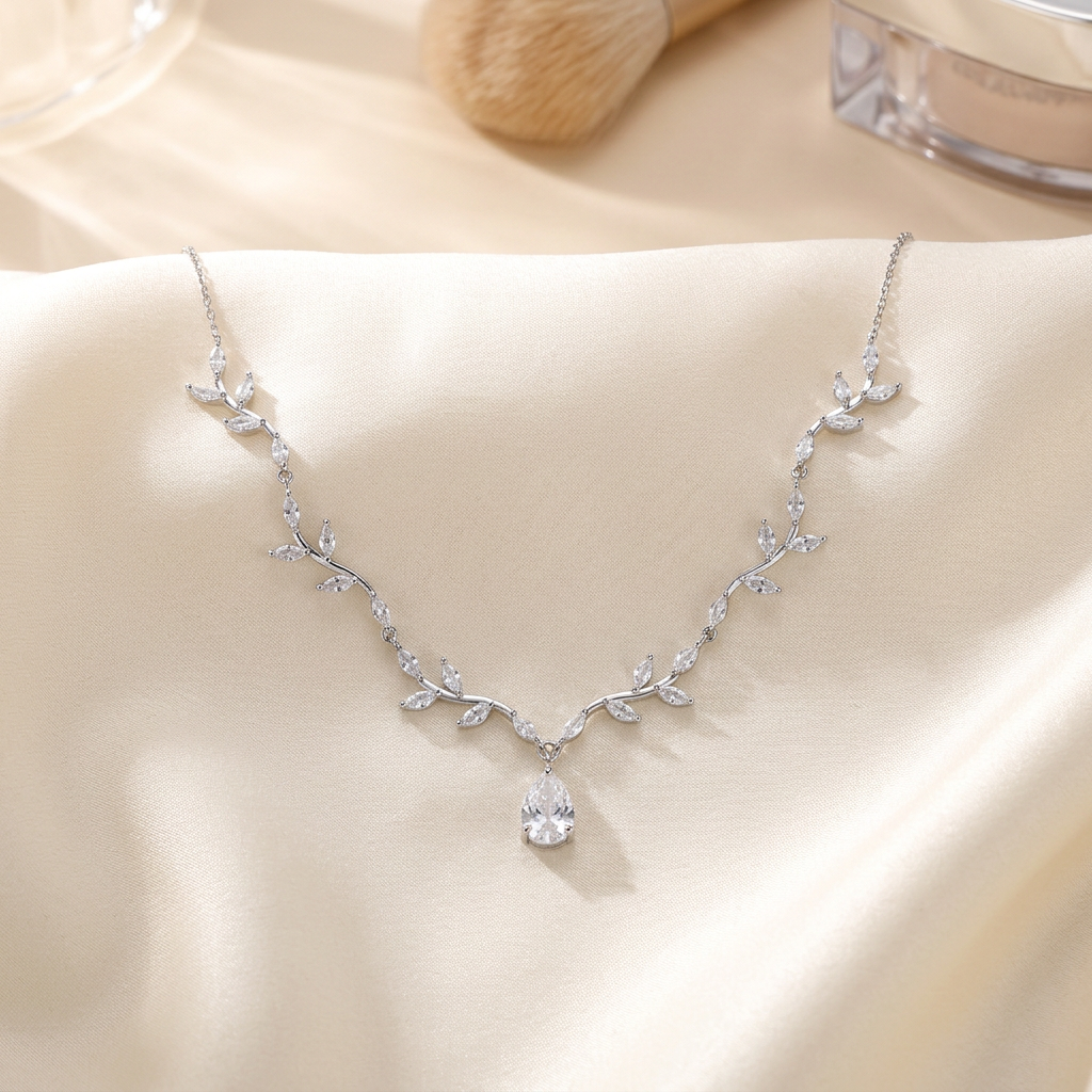 Silver leaf necklace on ivory satin