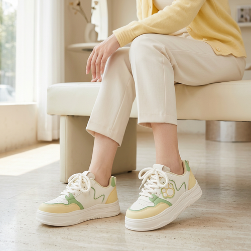 Woman wearing yellow and mint Cat Paw Sneakers