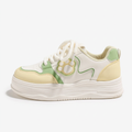 Yellow and mint Cat Paw sneaker, single-shoe side view